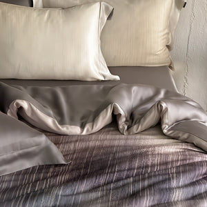 VILZSTUDIOS taupe-grey and ivory ombré satin duvet cover set with subtle ripple patterning and flanged borders