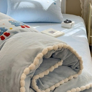 VILZSTUDIOS baby blue and camel fleece bedding set with raised tree and penguin motifs and white pom-pom trim
