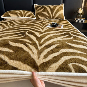VILZSTUDIOS earth-toned zebra-stripe and mottled marble fleece fitted sheet with contrasting plush trim