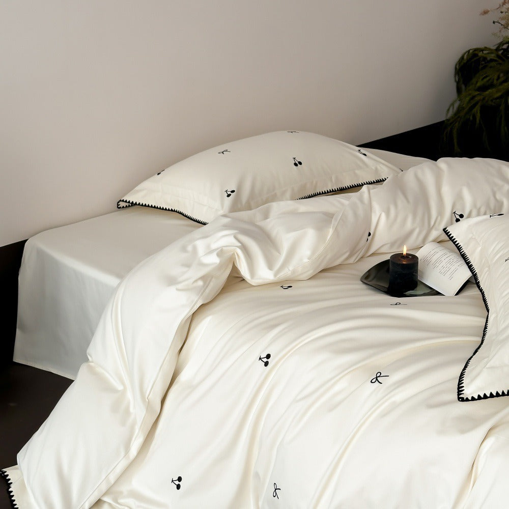 VILZSTUDIOS pastel satin duvet cover set with black cherry and bow embroidery and black zigzag borders