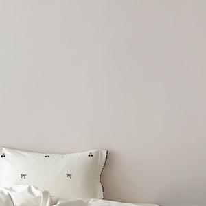 VILZSTUDIOS pastel satin duvet cover set with black cherry and bow embroidery and black zigzag borders