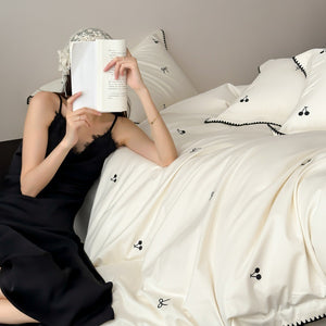 VILZSTUDIOS pastel satin duvet cover set with black cherry and bow embroidery and black zigzag borders
