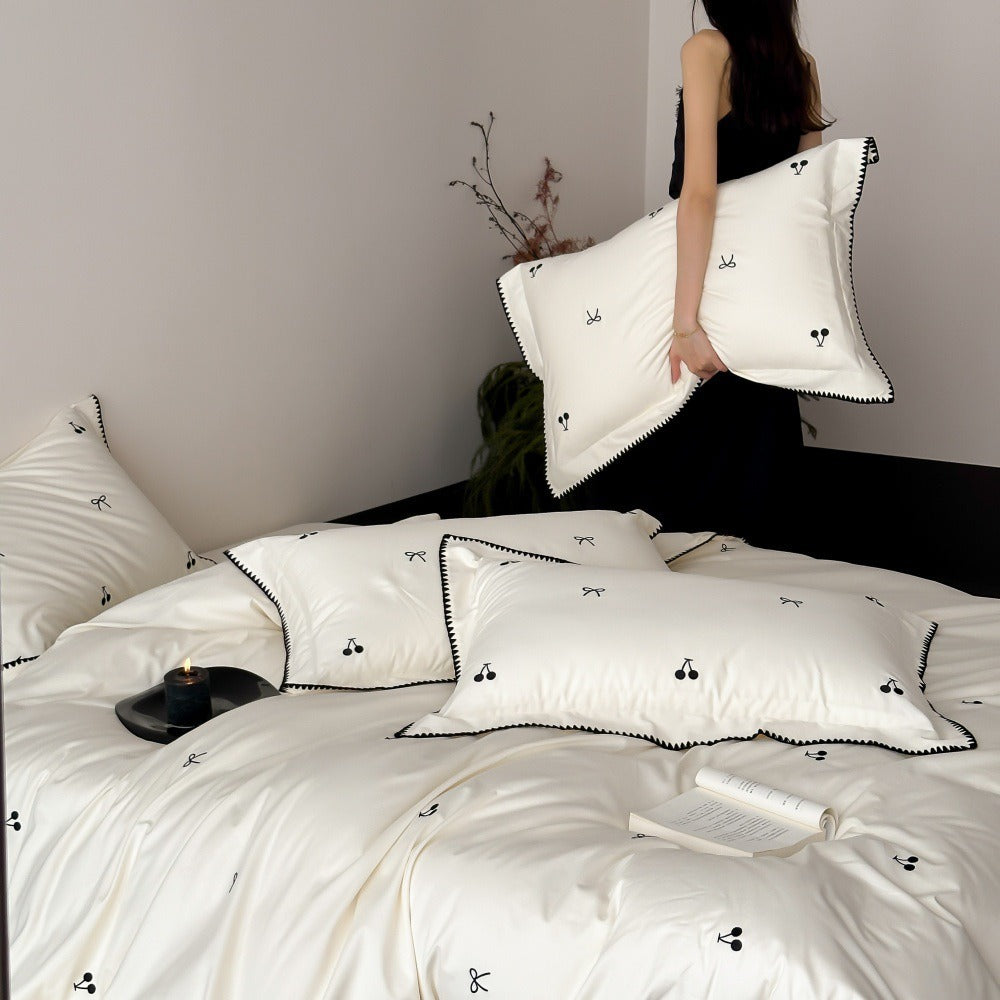 VILZSTUDIOS pastel satin duvet cover set with black cherry and bow embroidery and black zigzag borders