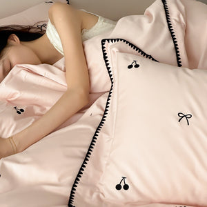 VILZSTUDIOS pastel satin duvet cover set with black cherry and bow embroidery and black zigzag borders