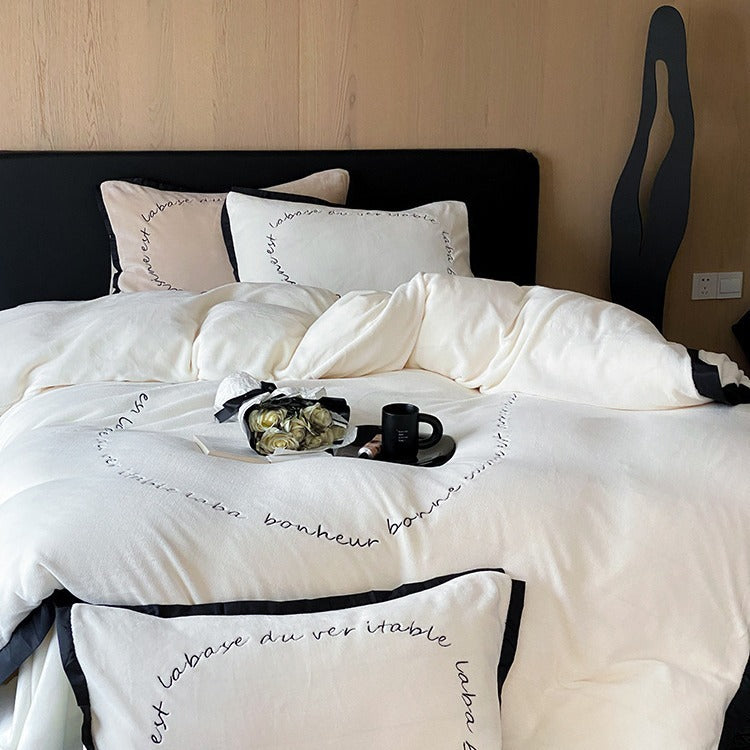 VILZSTUDIOS neutral fleece bedding set with black piping and cursive embroidery