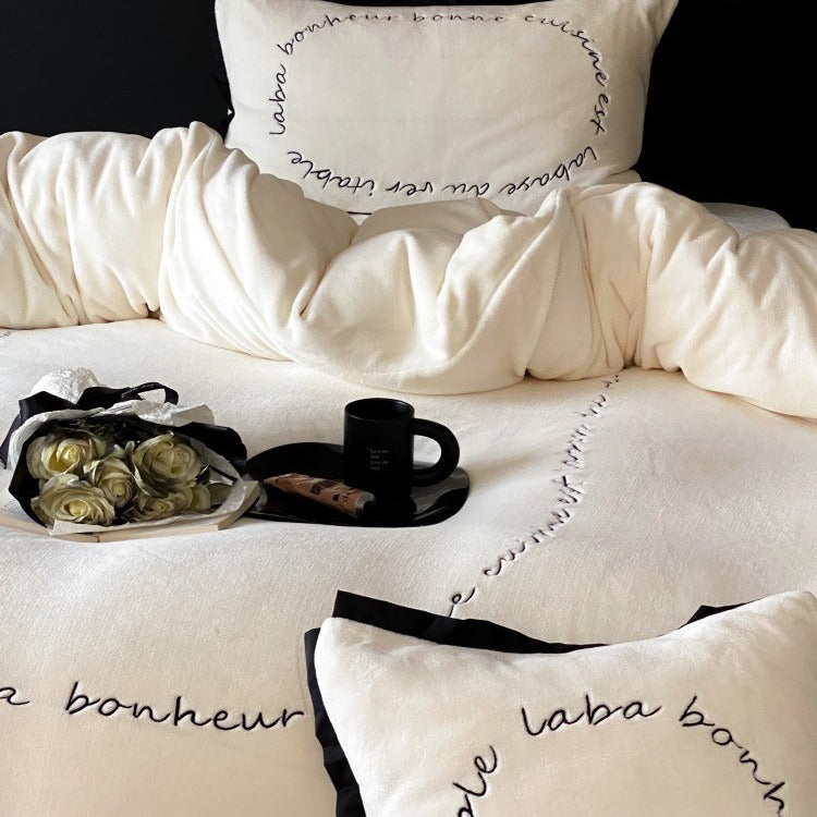 VILZSTUDIOS neutral fleece bedding set with black piping and cursive embroidery