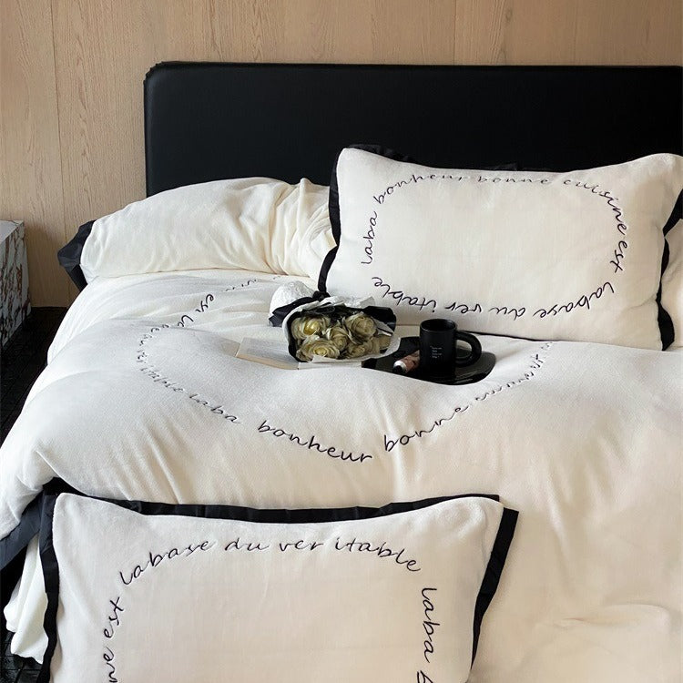 VILZSTUDIOS neutral fleece bedding set with black piping and cursive embroidery