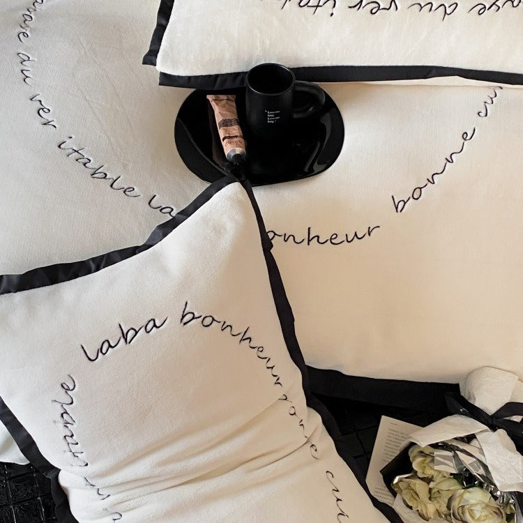 VILZSTUDIOS neutral fleece bedding set with black piping and cursive embroidery