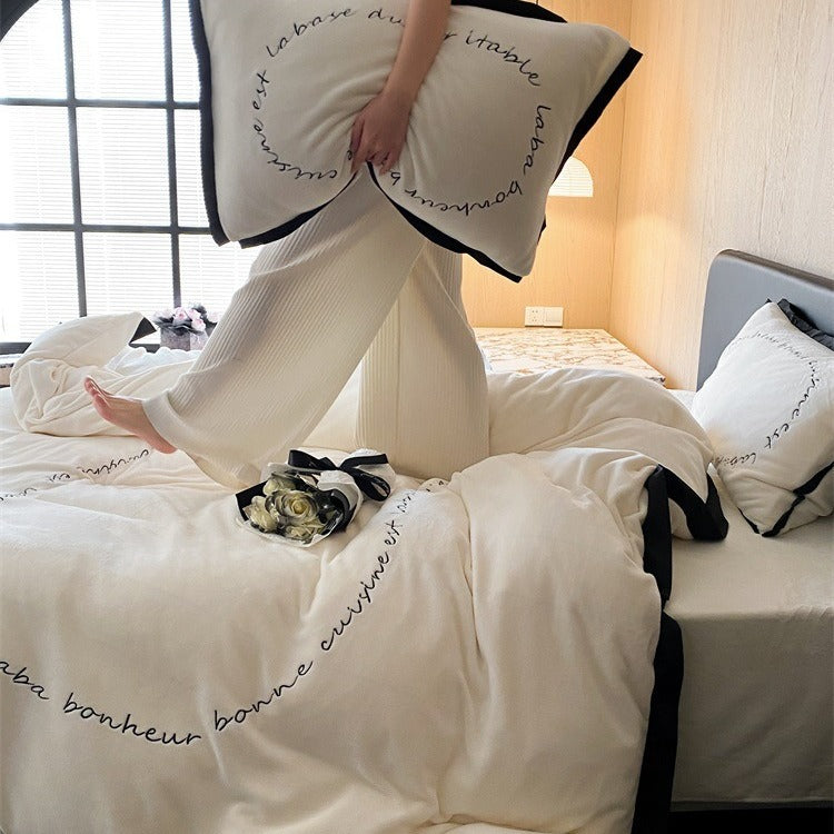 VILZSTUDIOS neutral fleece bedding set with black piping and cursive embroidery