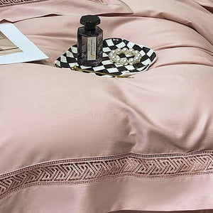 VILZSTUDIOS blush pink satin bedding set with geometric cut-out lace borders