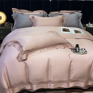 VILZSTUDIOS blush pink satin bedding set with geometric cut-out lace borders