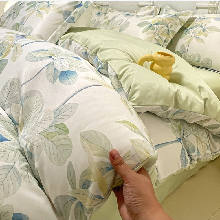 VILZSTUDIOS soft green and blue botanical print satin bedding set with coordinating solid-color reverse