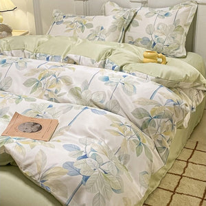 VILZSTUDIOS soft green and blue botanical print satin bedding set with coordinating solid-color reverse