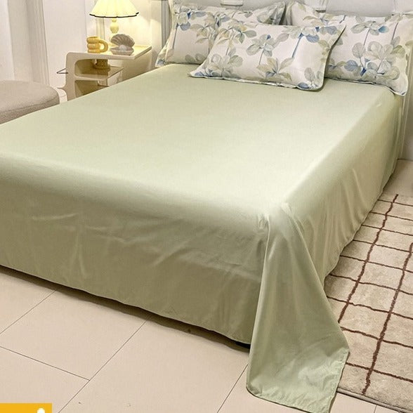 VILZSTUDIOS soft green and blue botanical print satin bedding set with coordinating solid-color reverse