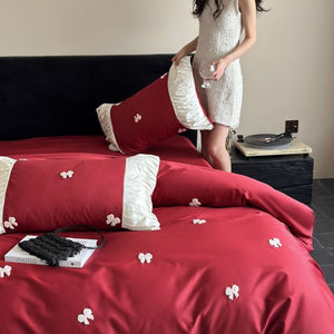 VILZSTUDIOS deep red or blush pink satin duvet cover set with embroidered bows and ivory ruffled pillowcases