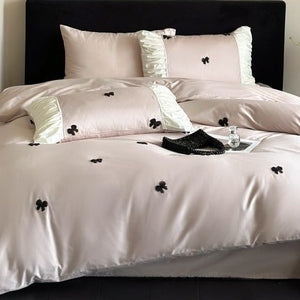 VILZSTUDIOS deep red or blush pink satin duvet cover set with embroidered bows and ivory ruffled pillowcases