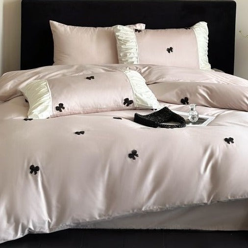 VILZSTUDIOS deep red or blush pink satin duvet cover set with embroidered bows and ivory ruffled pillowcases