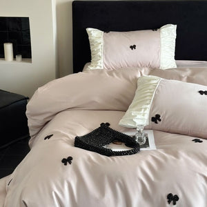 VILZSTUDIOS deep red or blush pink satin duvet cover set with embroidered bows and ivory ruffled pillowcases