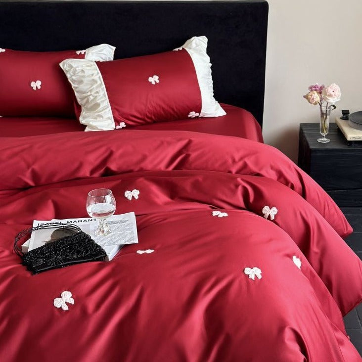 VILZSTUDIOS deep red or blush pink satin duvet cover set with embroidered bows and ivory ruffled pillowcases