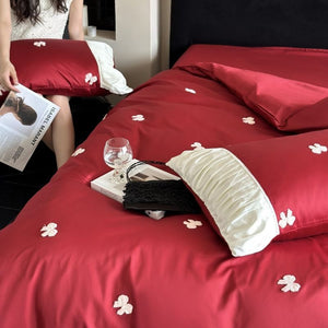 VILZSTUDIOS deep red or blush pink satin duvet cover set with embroidered bows and ivory ruffled pillowcases