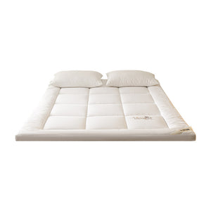 VILZSTUDIOS solid-color box-quilted mattress pad with tonal botanical embroidery and a thick cushioned border