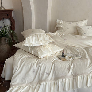 VILZSTUDIOS blush pink butterfly and floral embroidered bedding set with lace borders and gathered ruffles