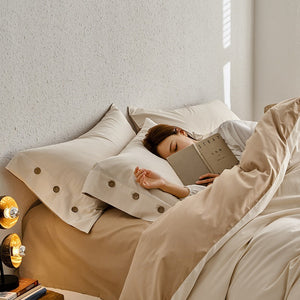 VILZSTUDIOS neutral and pastel two-tone duvet cover set with round button details on pillowcases