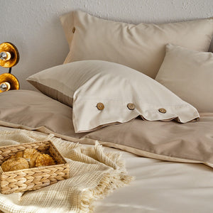VILZSTUDIOS neutral and pastel two-tone duvet cover set with round button details on pillowcases
