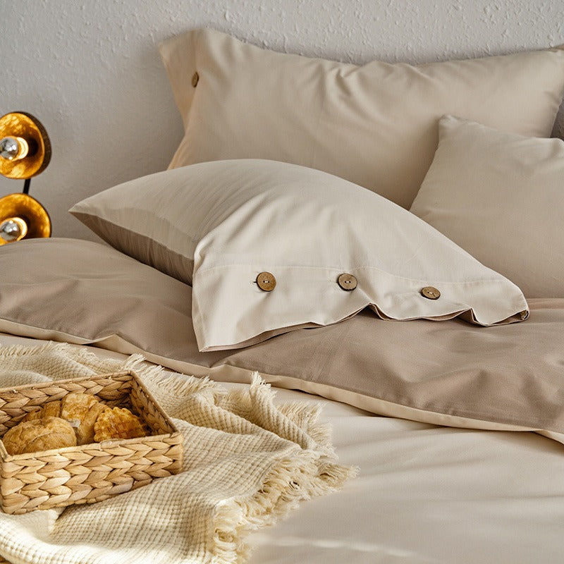 VILZSTUDIOS neutral and pastel two-tone duvet cover set with round button details on pillowcases