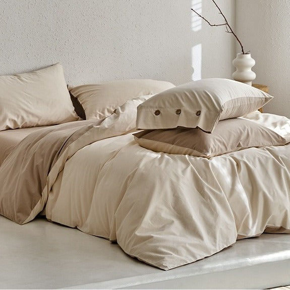 VILZSTUDIOS neutral and pastel two-tone duvet cover set with round button details on pillowcases