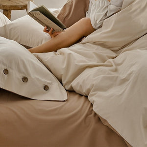 VILZSTUDIOS neutral and pastel two-tone duvet cover set with round button details on pillowcases