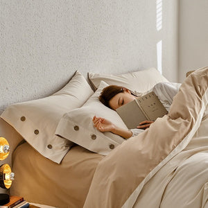 VILZSTUDIOS neutral and pastel two-tone duvet cover set with round button details on pillowcases