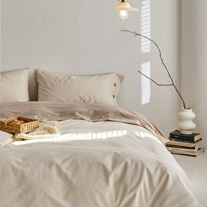 VILZSTUDIOS neutral and pastel two-tone duvet cover set with round button details on pillowcases
