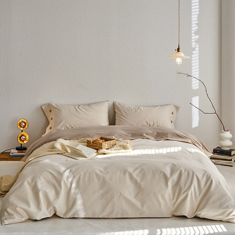 VILZSTUDIOS neutral and pastel two-tone duvet cover set with round button details on pillowcases