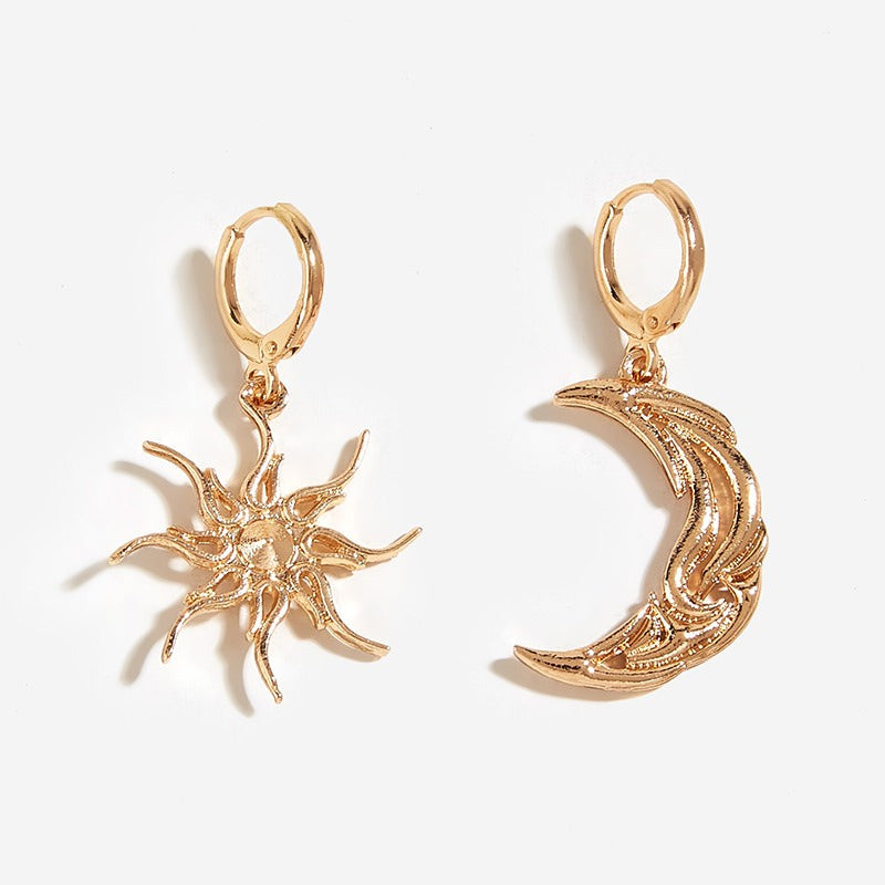 VILZSTUDIOS Mismatched earrings featuring a crescent moon and sun design