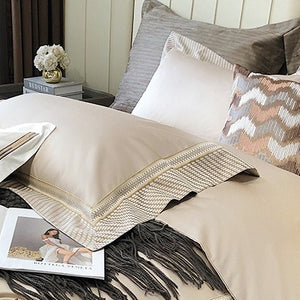VILZSTUDIOS champagne and taupe satin bedding set with houndstooth borders and geometric ribbon trim