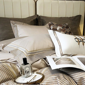 VILZSTUDIOS champagne and taupe satin bedding set with houndstooth borders and geometric ribbon trim