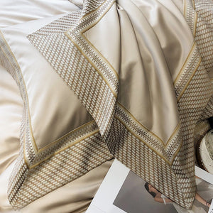 VILZSTUDIOS champagne and taupe satin bedding set with houndstooth borders and geometric ribbon trim