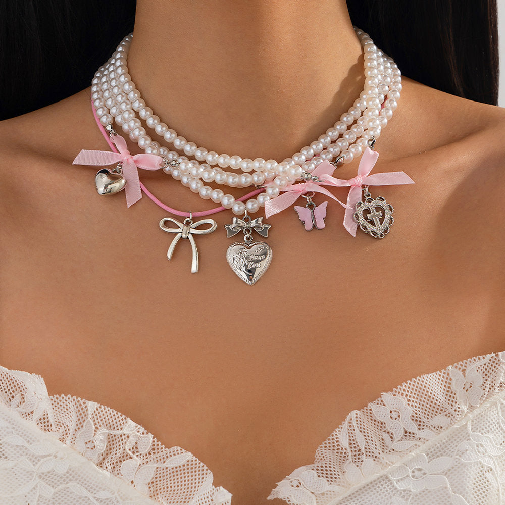 VILZSTUDIOS Layered pearl necklace set with charms and bows
