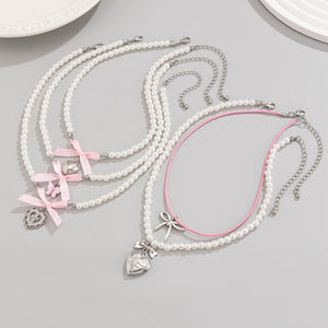 VILZSTUDIOS Layered pearl necklace set with charms and bows