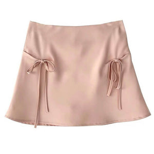 VILZSTUDIOS Chic satin mini skirt with bows by VILZSTUDIOS