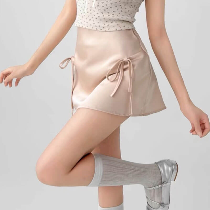 VILZSTUDIOS Chic satin mini skirt with bows by VILZSTUDIOS