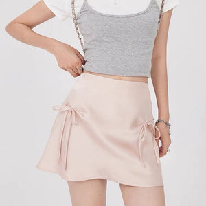 VILZSTUDIOS Chic satin mini skirt with bows by VILZSTUDIOS