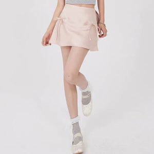 VILZSTUDIOS Chic satin mini skirt with bows by VILZSTUDIOS
