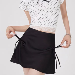 VILZSTUDIOS Chic satin mini skirt with bows by VILZSTUDIOS