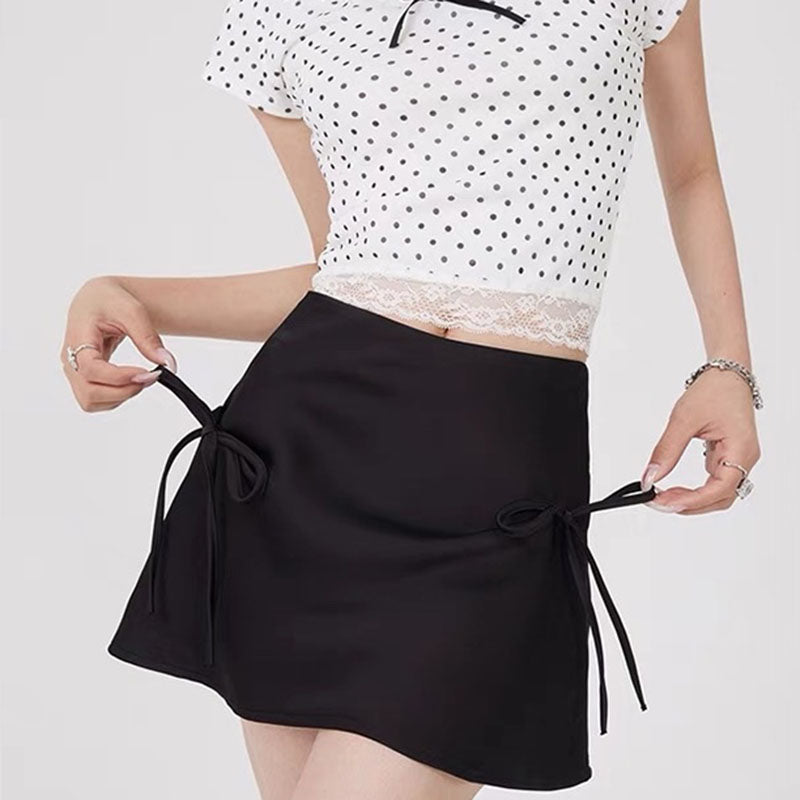 VILZSTUDIOS Chic satin mini skirt with bows by VILZSTUDIOS