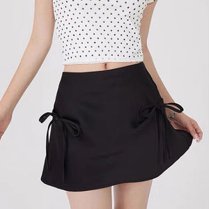 VILZSTUDIOS Chic satin mini skirt with bows by VILZSTUDIOS