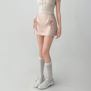 VILZSTUDIOS Chic satin mini skirt with bows by VILZSTUDIOS