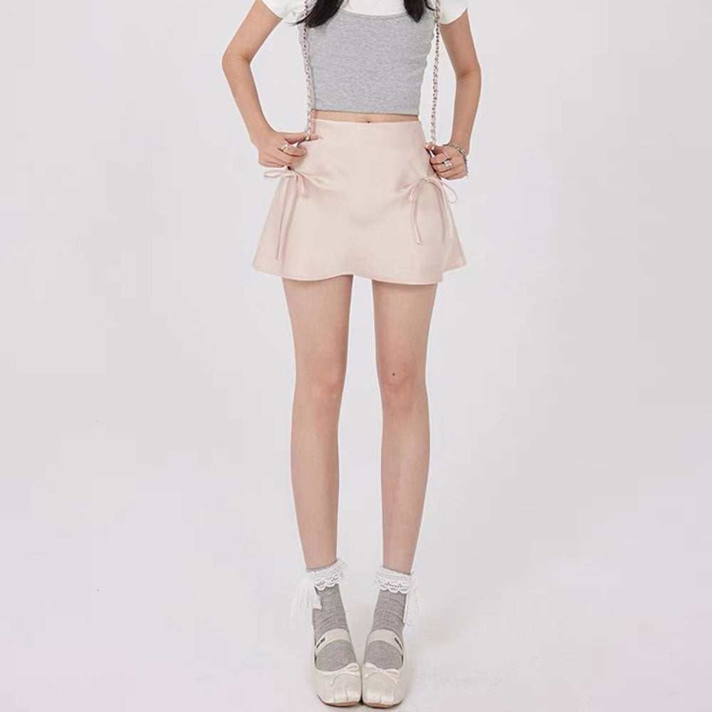 VILZSTUDIOS Chic satin mini skirt with bows by VILZSTUDIOS