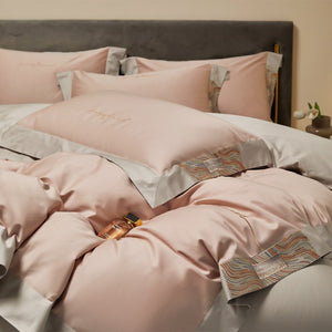 VILZSTUDIOS two-tone satin bedding set with broad contrasting borders and script embroidery